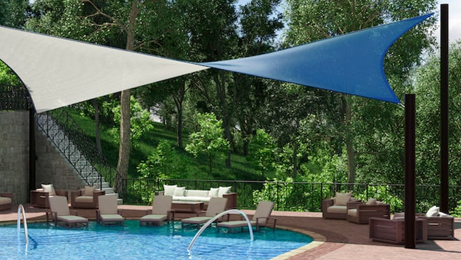 Shade sail installation over pool made with GALE Pacific knitted shade sail fabric.