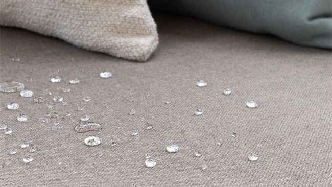 Water droplets on water resistant Sunbrella upholstery fabric.