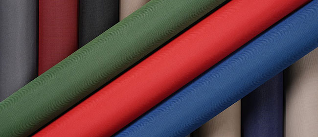 Collection of Hydrofend marine fabric rolls in a variety of colors