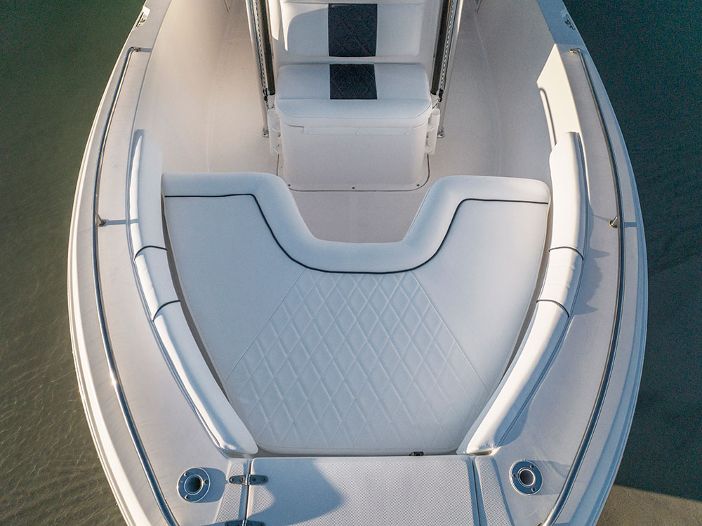 Top close-up view of a yacht with white upholstered seats