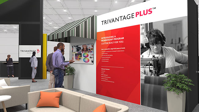 Trivantage Plus signage at conference expo booth with interested guests looking on