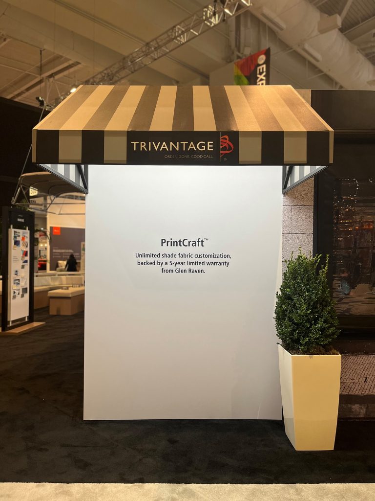 One side of the Trivantage booth at an exhibit featuring PrintCraft