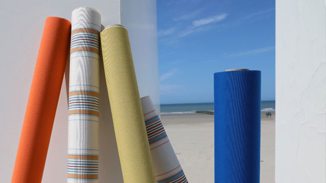 Several colorful rolls of newly added awning fabrics from the Dickson North American Orchestra Collection.