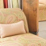 Light-patterned sofa and a throw pillow in a coordinated fabric