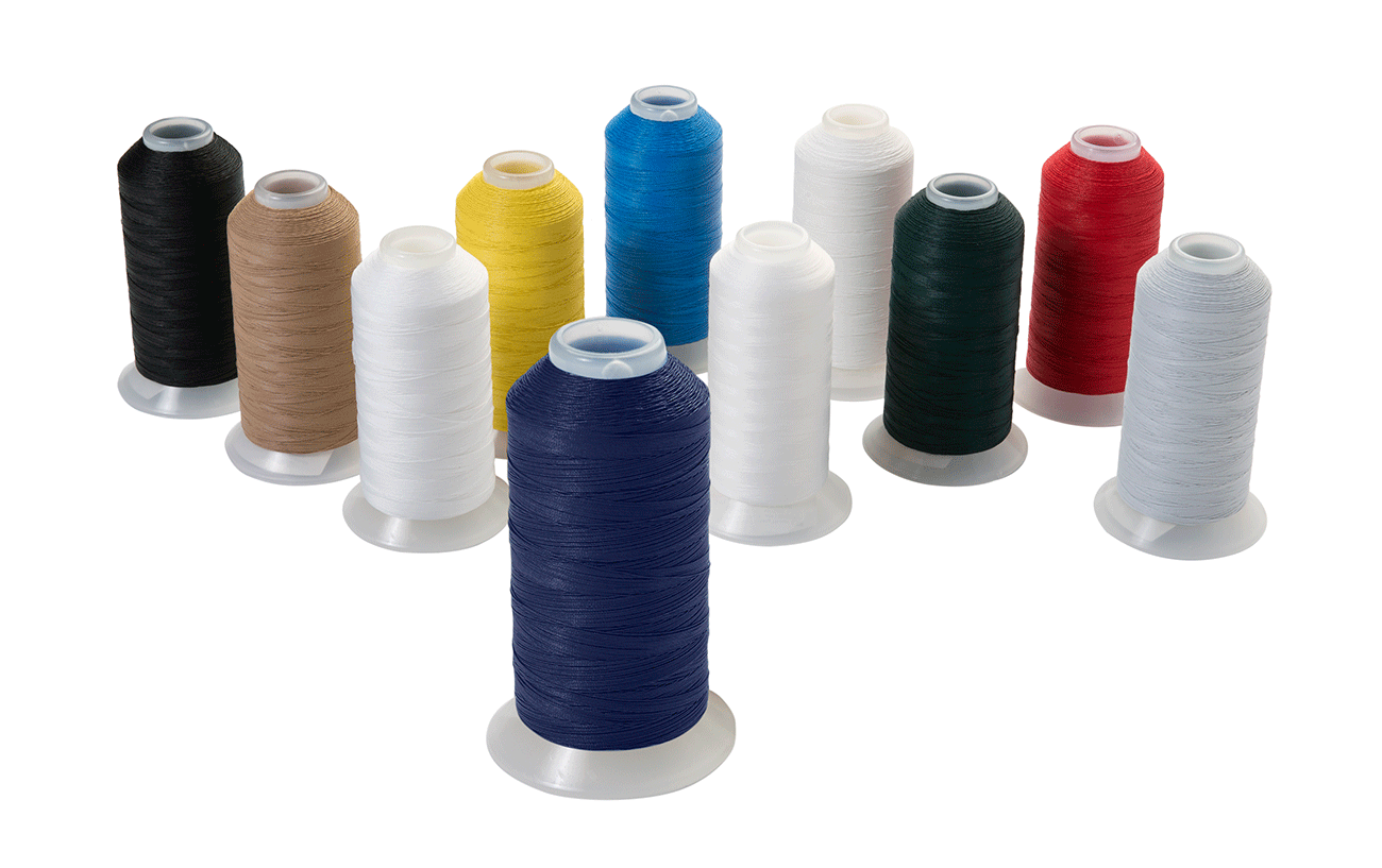 Assorted spools of threads in various solid colors