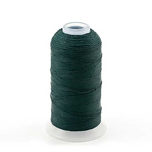A spool of dark green thread