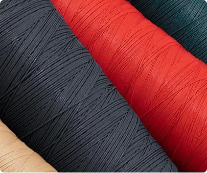 3 spools of thread colors red, white, and dark blue