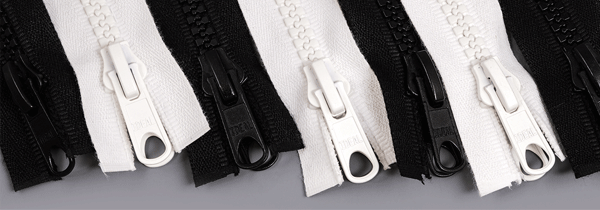 Rows of black and white zippers arranged alternately
