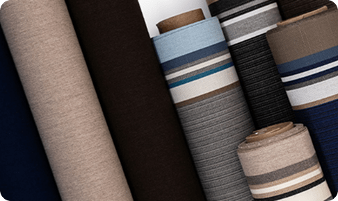 Image of rolls of awning on a vertical slant