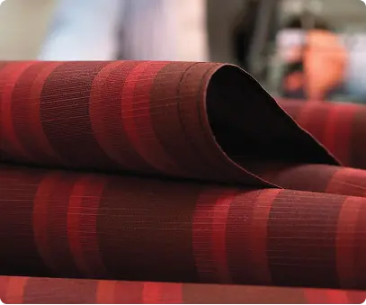 a shade sail red and dark stripped fabric