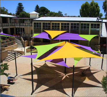 Top view of vibrant colored shade sails arranged in an outdoor setting