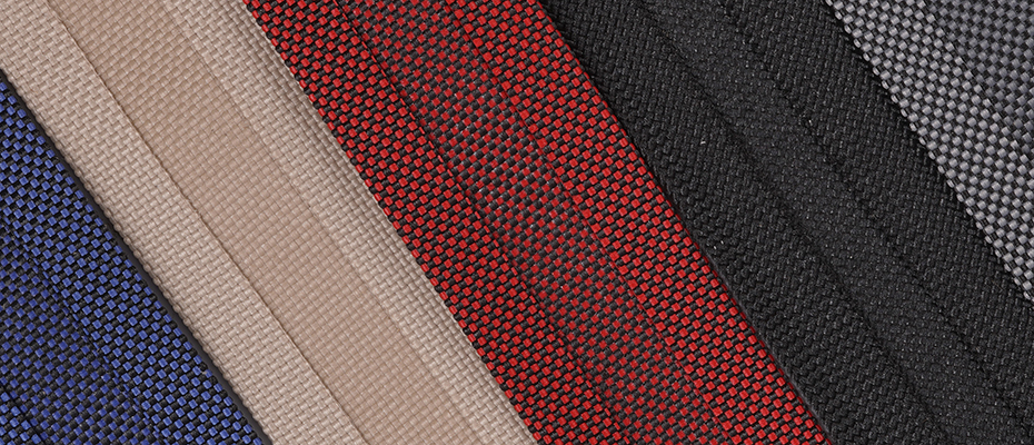 close up texture of hydrofend marine fabric binding in red, blue, black, tan, grey