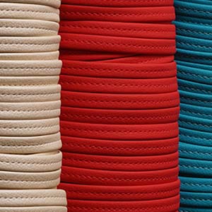 Beige, Red, and Dark Aqua binding