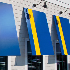 image of Cooley-Brite fabric, blue with one yellow strip on awnings