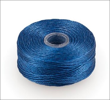 A spool of blue thich blue thread