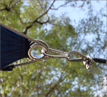 A mesh sheet being held by a clip attached to a rope