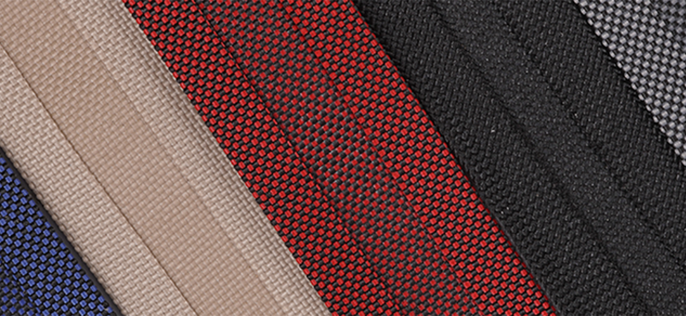 close up textured view of different colors of binding for professional upholstery and industrial sewing 