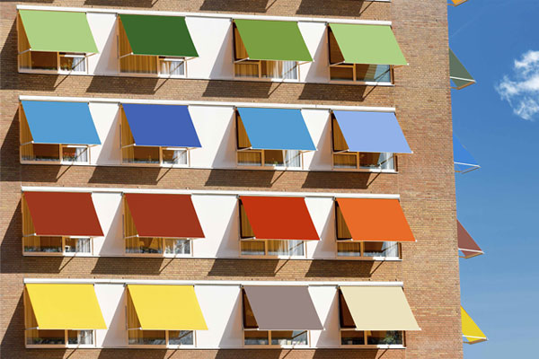 Sets of different colored awnings in front of a building