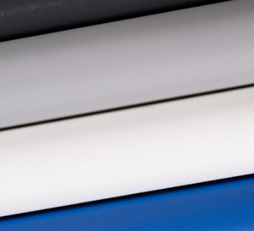 Rolls of silk satin fabric in elegant white and rich blue hues