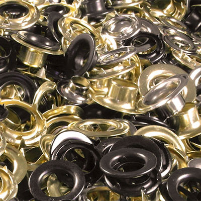 a pile of gold and silver grommets