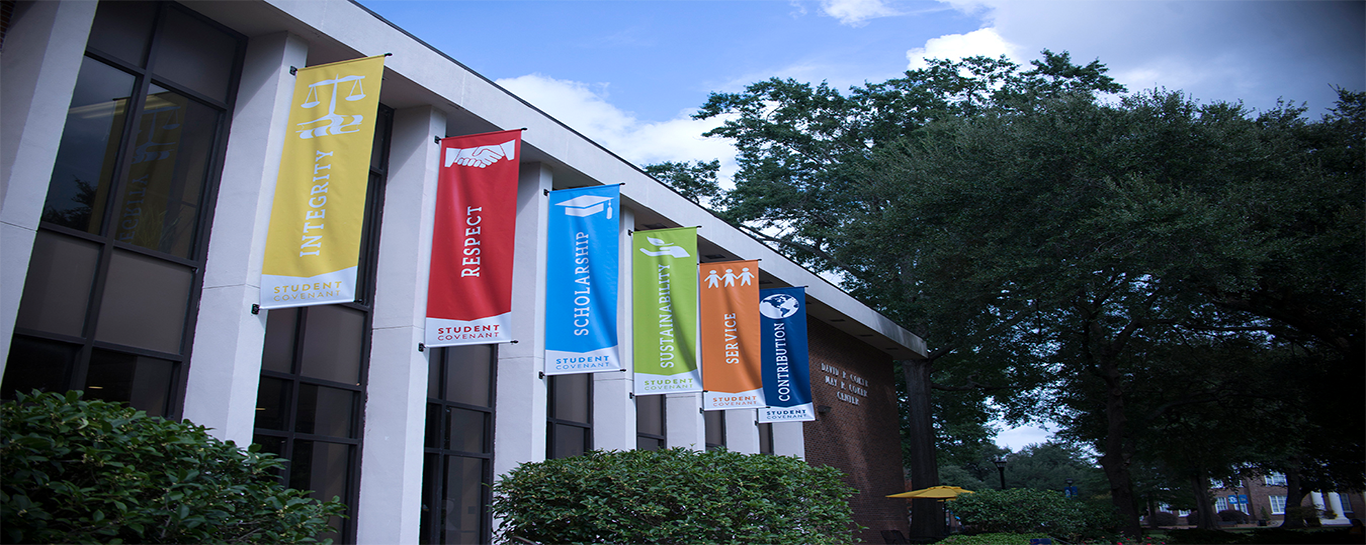 colorful banners hanging on the side of a building